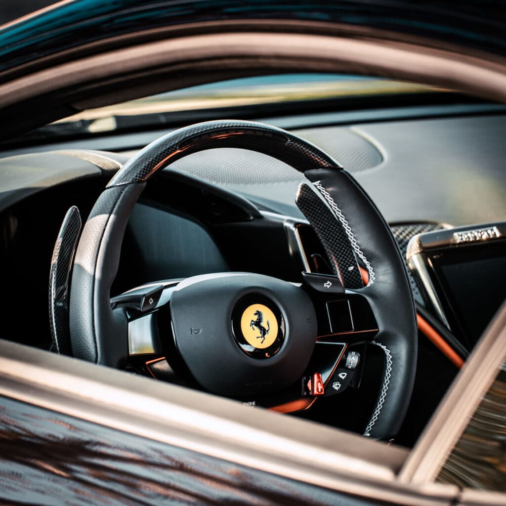 Brand photography Luxembourg: Ferrari steering wheel interior cabin