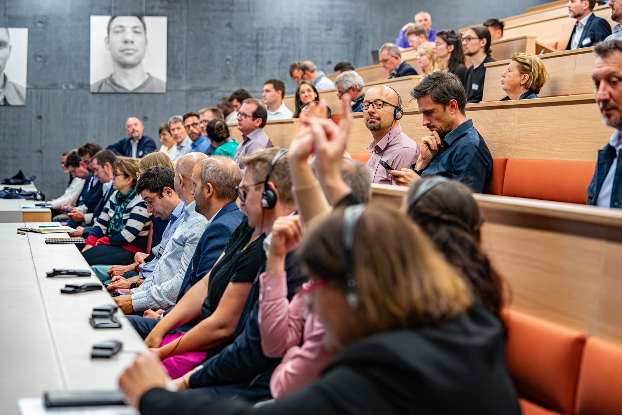 Event photographer Luxembourg: conference audience with headsets translation