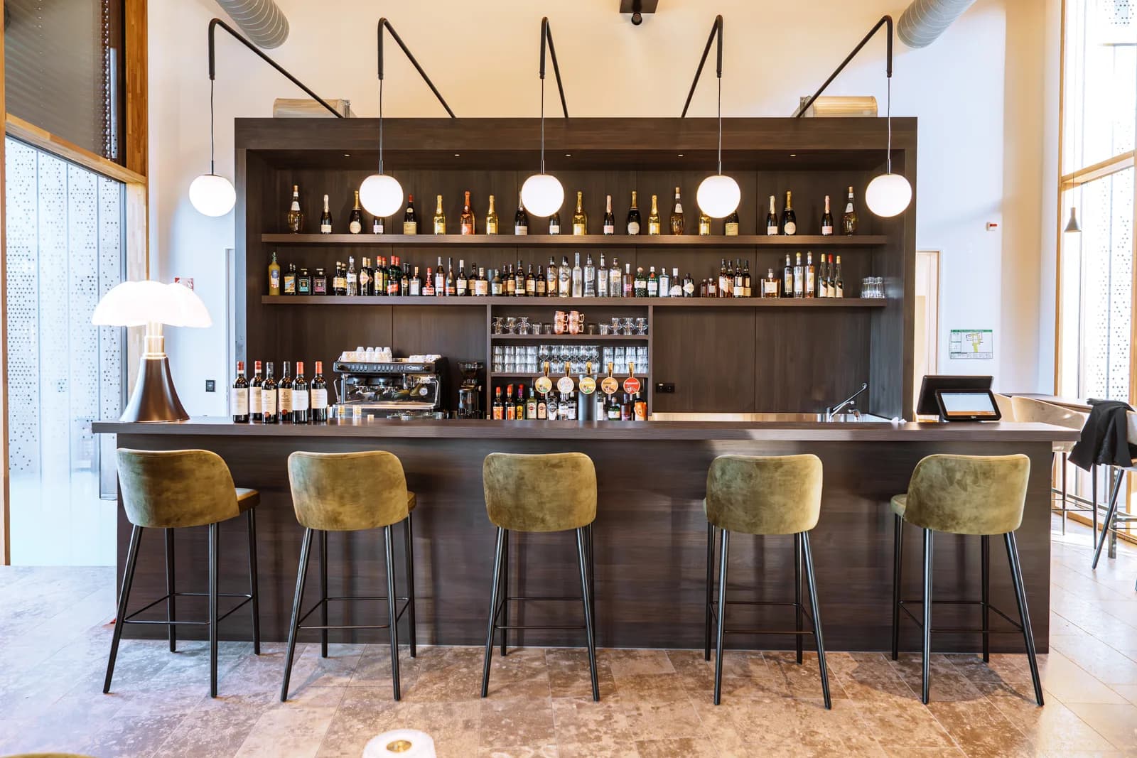 Brasserie S — The bar and its wine wall