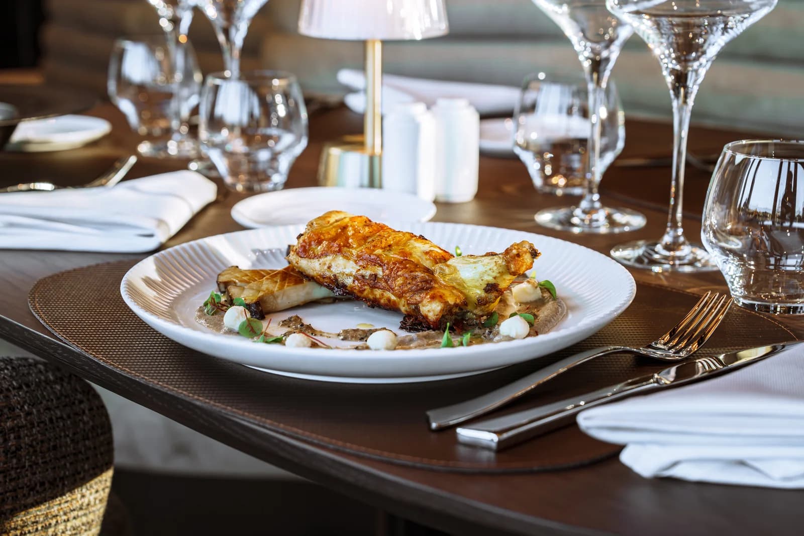 Brasserie S — Plated main, dressed for the table