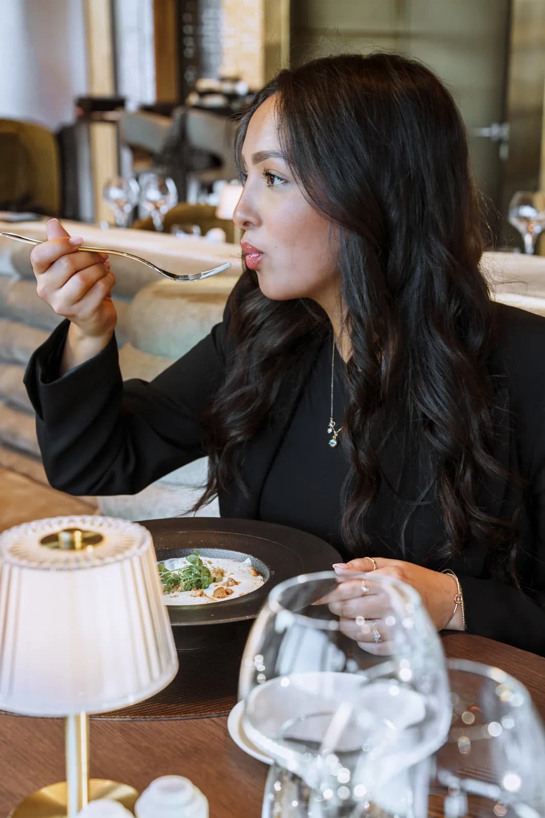 Brasserie S — A guest over lunch, glass in hand