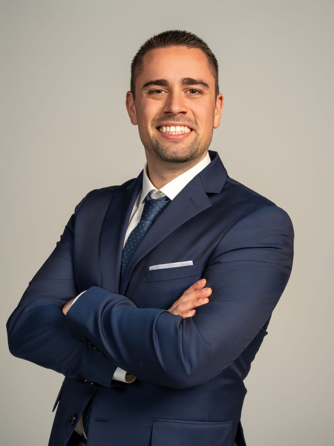 Chris Stambolidis, founder of Career Solutions Group — confident studio portrait, navy suit